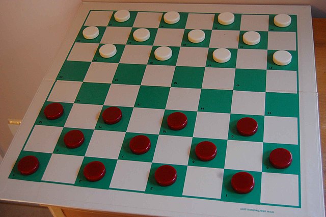 Starting position for American checkers on an 8×8 checkerboard; Black (red) moves first.