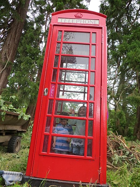 File:Children in a Red Telephone Booth.JPG