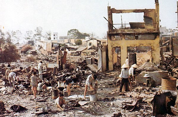 South Vietnamese civilians sort through the ruins of their homes in Cholon, the heavily damaged Chinese section of Saigon following the Tet offensive.