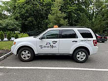 A municipal code enforcement vehicle in Flower Hill, New York, United States Code Enforcement Vehicle, Flower Hill, Long Island, New York June 11, 2022.jpg