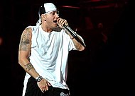 Eminem's "Lose Yourself was the longest running number one song of 2002, spending 12 weeks in total (8 in 2002 and 4 more weeks in 2003). The song won multiple Grammy Awards and has a massive legacy. EMINEM rapping Anger management tour 2003.jpg