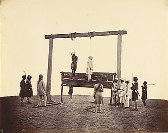 The hanging of two participants in the Indian Rebellion, Sepoys of the 31st Native Infantry. Albumen silver print by Felice Beato, 1857.