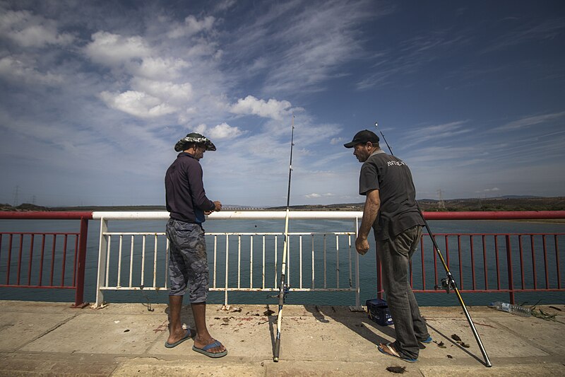 File:Fishermen on the road leading to the city of Asilah coming from Tangier.jpg