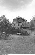 Residential mill house, grinding building and outbuildings of a mill complex