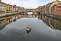 Arno River with the "Ghibellino". The traditional boat of "renaioli fiorentini"