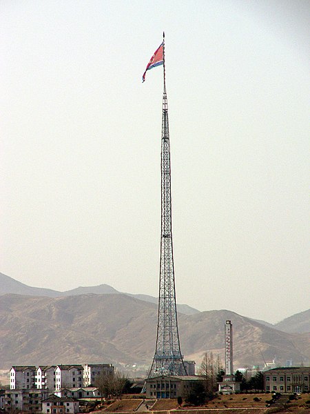 The world's sixth tallest flagpole flying a 270 kg (595 lb) Flag of North Korea, is 160 m (525 ft) in height, over Kijŏng-dong ("Peace village"), near