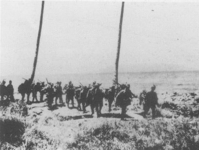 Japanese troops from the "Aoba" Regiment march along the shore of Guadalcanal shortly after landing during the first week of September 1942.