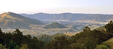 A town along the Pan-American Highway within a volcanic crater Guatemala town volcanic crater.jpg