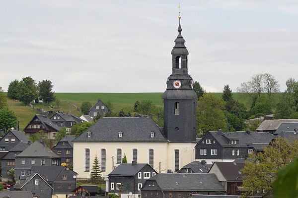 A slate-faced church and homes in Wurzbach, Germany