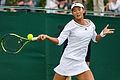 Liu Fangzhou competing in the second round of the 2015 Wimbledon Qualifying Tournament at the Bank of England Sports Grounds in Roehampton, England. The winners of three rounds of competition qualify for the main draw of Wimbledon the following week.