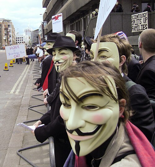 Members of the group Anonymous wear Guy Fawkes masks at a protest against the Church of Scientology. London, 2008.