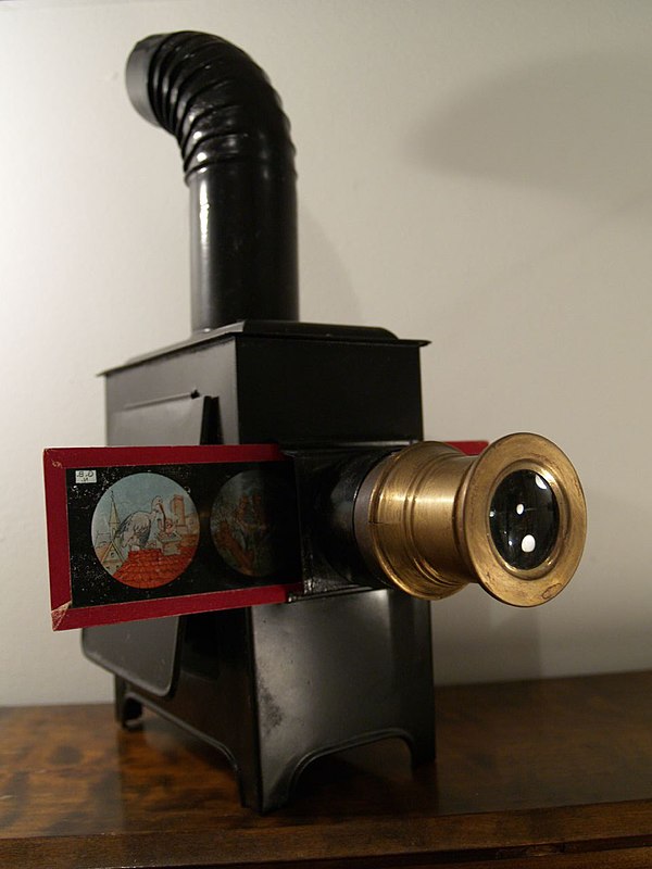 19th century magic lantern with printed slide incorrectly inserted (upright, which would be projected by the lantern as an inverted picture)