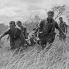 Marines of E/2/9 carry a wounded Marine to a MEDEVAC helicopter during Operation Hickory III Marines with wounded.jpg