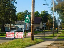 Several election signs posted by the Seneca Party. The middle sign advertises the party's endorsement of straight-ticket voting. NY 353N in Salamanca.jpg