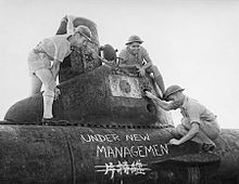 Australian sailors take possession of a midget submarine at a Japanese naval base near Tokyo in September 1945. New management (AWM 019164).jpg