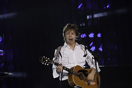 McCartney playing an Epiphone Texan in 2014.