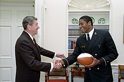 President Ronald Reagan with Napoleon McCallum during a photo opportunity in the Oval Office President Ronald Reagan during a photo opportunity with Napoleon McCallum Jr the star running back for the United States Naval Academy football team in the Oval Office.jpg