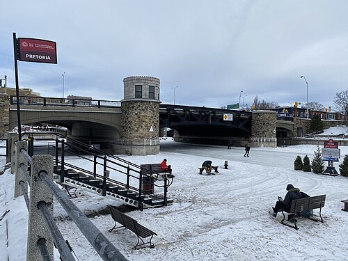 Skating under Pretoria Bridge on the Rideau Canal Skateway in Ottawa Canada