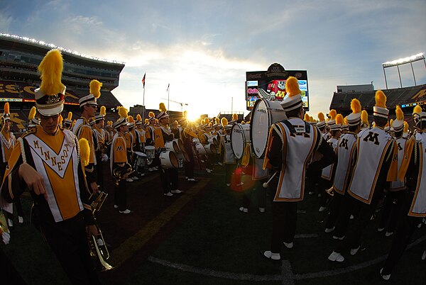 The Pride of Minnesota gathers on the field after the 4th quarter for their post-game performance.