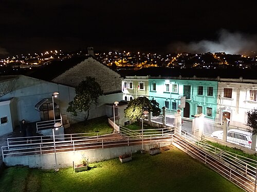 Darkness. The city lights adorn the dark beauty of Quito, viewed from La Loma grande