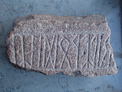 Woðinz (read from right to left), a probably authentic attestation of a pre-Viking Age form of Odin, on the Strängnäs stone.