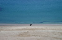 People at the beach of Sesimbra, Portugal