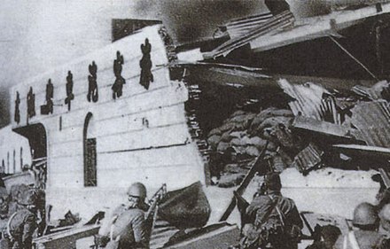 Japanese troops reaching the destroyed North Station in downtown Shanghai