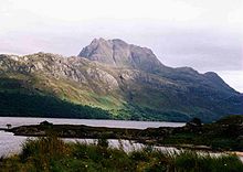 Slioch formed of Torridon Group sandstones lying on an irregular unconformity over Lewisian gneiss, seen in the middle and foreground around Loch Maree Slioch from Loch Maree.jpg