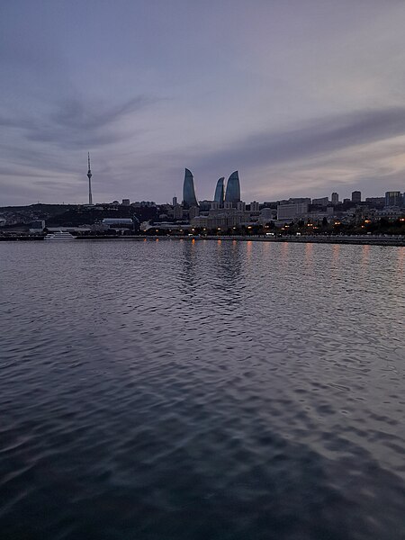 File:The Flame Towers and Baku TV Tower in the background of the Caspian Sea.jpg