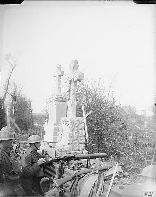 Troops of the 10th (Service) Battalion, Queen's Own (Royal West Kent) Regiment manning a Lewis machine gun in a front line trench running through a ce