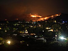Flames and plumes of smoke from the Tiger Fire can be seen from Spring Valley, Arizona overnight on July 6, 2021 Tiger Fire, Arizona.jpg