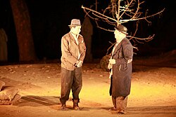 Beckett's Waiting for Godot is considered a hallmark of the Theatre of the Absurd. The play's two protagonists, Vladimir and Estragon (pictured, in a 2010 production at The Doon School, India), give voice to Beckett's existentialism.