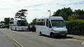 English: Two Wightbus vehicles in Crossfield Avenue, Cowes, Isle of Wight, loading up outside Cowes High School on afternoon school journeys. On the left is 5801 (HW04 DFN), a Dennis Javelin/Plaxton Profile, on school route 112 to Camp Hill via Four Cross and Northwood. On the right is 5881 (KE04 EAG), a Mercedes-Benz Sprinter/UVG, on either route 50 or 50A.