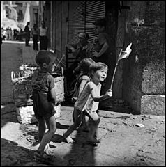 “Children In Naples, Italy”. Children playing in the streets. Photographed by Lieutenant Wayne Miller, July 1944. U.S. Navy Photograph, now in the collections of the National Archives.jpg