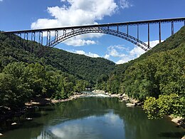 2017-09-08 14 00 10 View northwest down the New River towards the New River Gorge Bridge (U.S. Route 19) from the Tunney Hunsaker Bridge (Fayette County Route 82) over the New River between Fayette and South Fayette in Fayette County, West Virginia.jpg