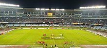 FC Goa (in black) and Mohammedan SC (in white) lined up during the 2021 Durand Cup Final at Vivekananda Yuba Bharati Krirangan. 2021 Durand Cup Final-1.jpg