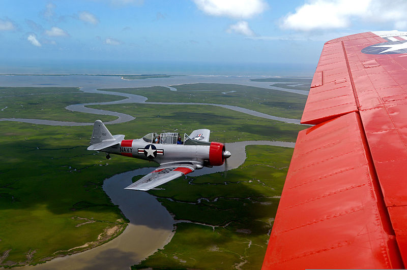 File:A retired U.S. Navy T-6 Texan trainer aircraft, left, flies beside a retired Navy C-45 Expeditor during the Salute from the Shore Independence Day event July 4, 2013, near Myrtle Beach, S.C 130704-F-CX352-016.jpg