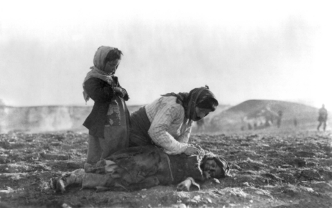Armenian woman kneeling beside dead child at Armenian Genocide, by the American Committee for Armenian and Syrian Relief (restored by EtienneDolet and MjolnirPants)