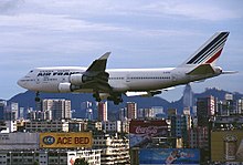 An Air France Boeing 747 passing above Kowloon, landing at the old airport.