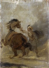 A Man holding a Horse