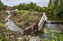 View looking upriver at the old Footbridge dam and fish ladder to the egg collection facility. C.D. "Buzz" Besadny Anadromous Fish Facility.jpg