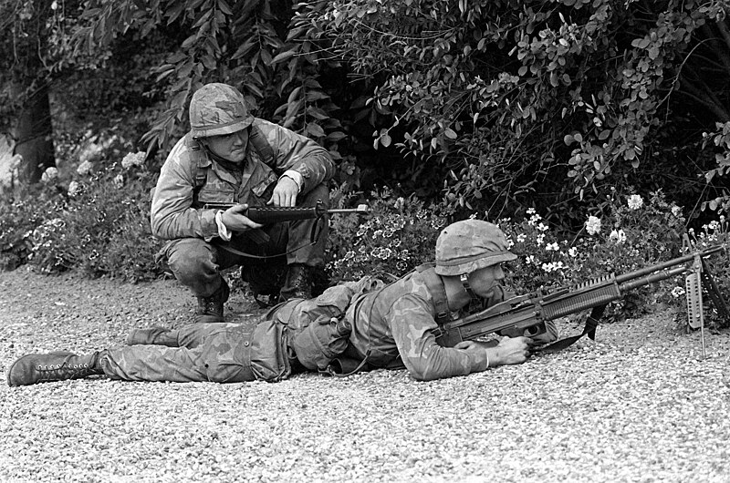 File:CPL Blum and LCPL Macknight from the 4th Marine Amphibious Brigade search the terrain for enemy forces during Operation Northern Wedding '82 DM-SN-83-01975.jpg