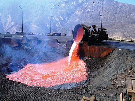 Pouring smelter slag onto the dump, El Teniente