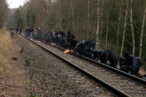 Removing ballast from a train track to protest transport of nuclear waste by rail