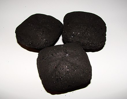 The tendency of charcoal to cake is exploited in producing briquettes, which are more conveniently handled than loose charcoal. Charcoal Briquette.JPG