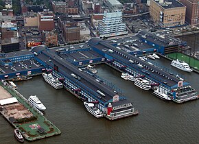 Chelsea Piers as seen from the air. Pier 62 is on the left, with the driving range of Pier 59 partially visible on the right Chelsea Piers.jpg