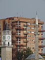 Clocktower with Mosque Minaret and Apartment Facade - Skanderbeg Square - Tirana - Albania (40987352950).jpg