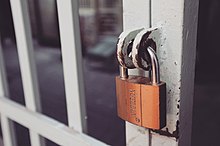 Gatekeeping concept Closeup-photography-of-white-gate-with-brass-colored-padlock-846288.jpg