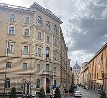 Building of the General Curia of the Jesuit order on Borgo Santo Spirito in Rome, with the dome of St. Peter's Basilica in the background Curia Generalis.jpg