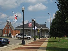 The nearby Depot Museum houses the original statue. Depot Museum Enterprise Alabama.jpg